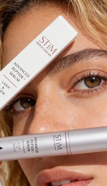 Applying lash serum along the lash line